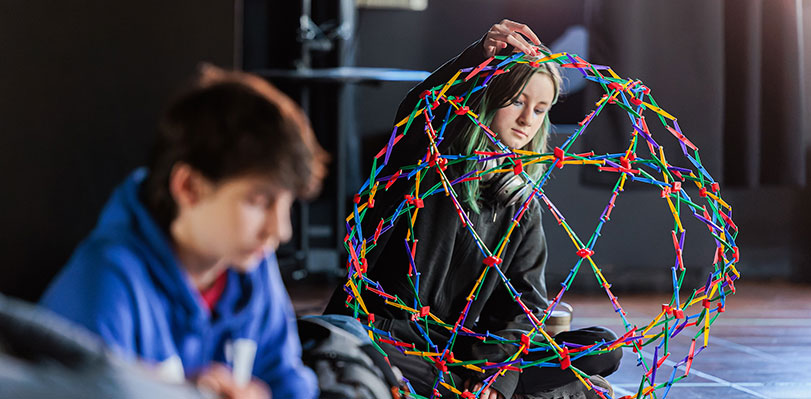 Sycamore School student experimenting with ball