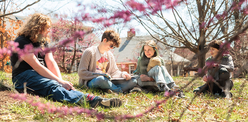 Sycamore School students studying in field