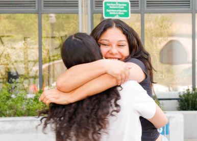 Two Sycamore School students hugging