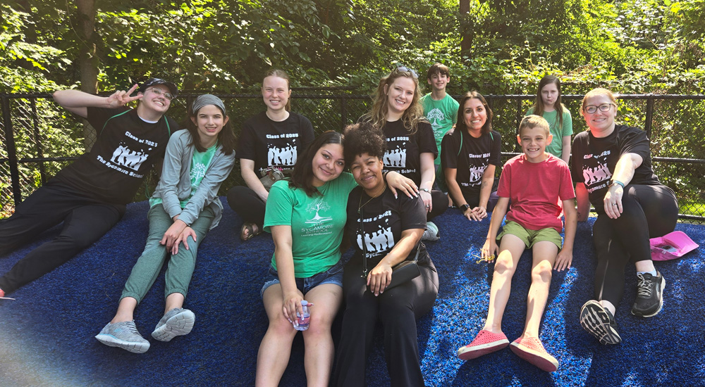 TheSycamoreFund Group of The Sycamore School students outside sitting together in a group